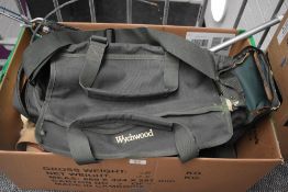 A wytchwood fishing bag containing some tackle and a canvas and leather fishing shoulder bag with
