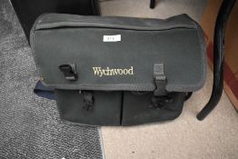 A witchwood fishing bag containing a tackle box of course and float fishing tackle and some sea