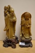 Two 19th Century soapstone deities, Shou Lao and Guanyin, each raised on carved bases, the largest