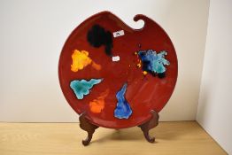 A 20th Century Poole pottery charger, in the Palette design, signed 'N. Massarella' (Nicky