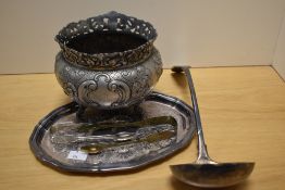 A small selection of plated items including small tray, large ladle and two pairs of sugar tongs