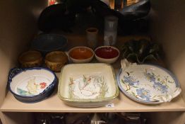 An assortment of studio pottery, some signed, mainly dishes and vases etc.