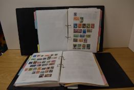 Two folders of assorted nationality stamps with some loose.