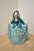 A German Art Deco Katzhutte Porcelain figurine, depicting gril in flowing green dress, printed