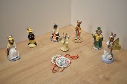 A group of seven Royal Doulton bone china 'Bunnykins' figures, various including England Athlete