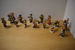 A group of thirteen Goebel porcelain figures and figurines, of typical design some larger, to