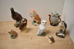 A group of Royal Doulton for Whyte & Mackay,and Beswick spirit decanters, Osprey decanter and Grouse