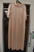 A vintage blush ivory coloured glossy satin nightdress.