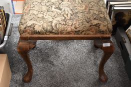 An early 20tyh century dressing table stool having Queen Anne style legs.