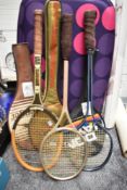 Three retro badminton rackets.