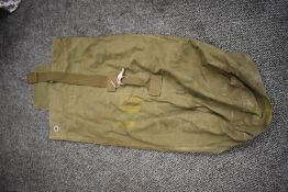A large vintage army kit bag.