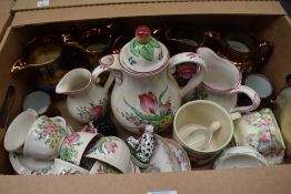 Five copper lustre ware jugs, a Luneville France part coffee service (24 pieces approx) having