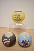 Two early 20th Century Carlton Ware crested matchstick holders/strikers, measuring 7cm high, and a