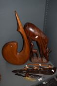 An African carved hardwood antelope and calf, measuring 45cm tall, another large carved wooden