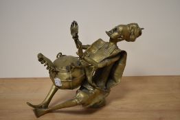 A Nigerian brass figure of a seated musician, approx 22cm high.