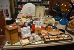 A large selection of games and equipment such as wooden dice cups, marbles, dominoes, playing