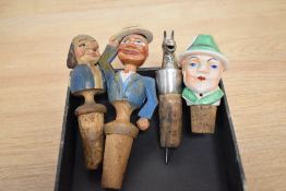 Two mid-20th Century Italian Anri carved figural bottle stoppers, the largest measures 14cm high,