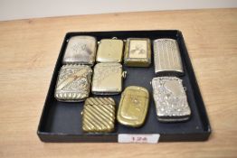 An assorted collection of silver, white metal, and other vesta cases and match holders, the