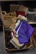 An assortment of vintage items including a Masonic Apron, ladies belts, sewing patterns and a