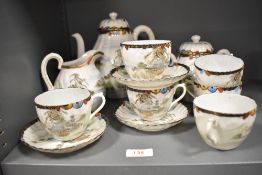 A 19th/20th Century Japanese egg shell tea service, comprising teapot, twin handled lidded pot, milk