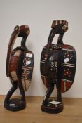 Two 20th century African carved and painted wood guardian birds, possibly Baga, largest being 46cm