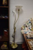A modern crafters gooseneck standard lamp having integral magnifying glass and clamp.