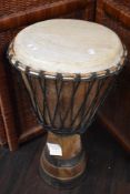 An African rope turned Djembe drum, measuring 65cm high