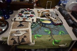 A selection of traditional folk art woven wall hangings from Peru, Nepal, Kenya and Ethiopia.