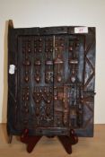 An interesting Malian Dogon African carved wooden pegged door, measuring 24cm x 28cm overall