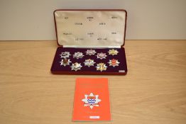 A cased set of Limited Edition London Fire Brigade Historic Badges, 10 in the set, with booklet, Set