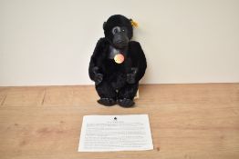 A modern Steiff Bear, 660634 Gorilla with yellow tag and button, in pull string bag