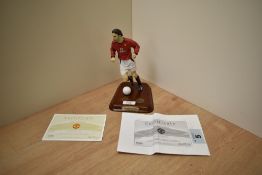 A 2003 Danbury Mint Hand Painted Figure, Ruud Van Nistelrooy, on wooden plinth with football and