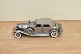 A 1989 Franklin Mint 1:24 scale Die-cast, 1933 Duesenberg SJ Twenty Grandwith tag and
