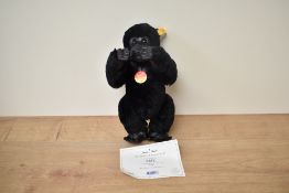 A modern Steiff Bear, 660634 Gorilla with yellow tag and button, in pull string bag