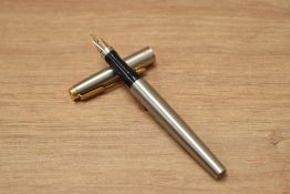 A Parker 75 aero fill fountain pen in brushed steel with gold trim having Parker 585 M France nib.
