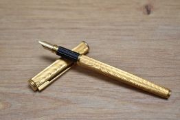 A boxed Waterman Executive converter fill fountain pen in gold moire having Waterman 18K 750 nib.