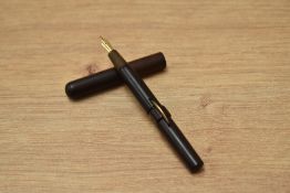 A Conklin crescent fill fountain pen in BHR having Meteor F 18ct No.10 nib. Crack to base of cap.
