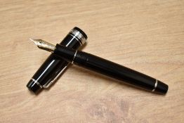 A boxed Sailor Pro Gear II converter fill in black with chrome trim having 1911 21K 875 Sailor nib.