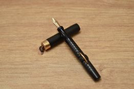 A Conklin crescent fill ring top fountain pen in chased BHR having a Conklin Toledo nib.