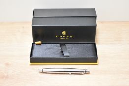 A boxed Cross stubby striped chrome ballpoint.