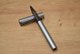 A boxed Lamy Al-Star rollerball pen in lilac.