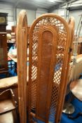A vintage bamboo tri fold room divider