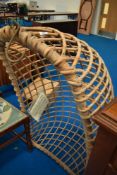 A vintage wickerwork swing seat