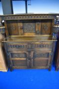 An early 20th Century oak court cupboard with carved panels, width approx. 106cm