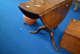A 19th Century oak pedestal table having drop flaps, approx 93 x 31cm, height 69cm