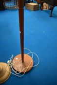 A vintage teak standard lamp