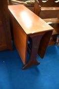 A vintage teak gateleg dining table, approx 91 x 31cm