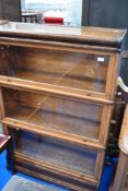 A Globe Wernicke or similar oak three tier stacking bookcase