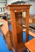 A reproduction narrow display cabinet