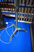 An early 20th Century brass standard lamp, telescopic